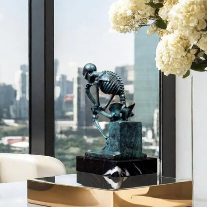 Bronze Thinker Sculpture - Abstract Rodin-Inspired Skeleton Art Statue for Home Decor and Halloween Skull Theme.
